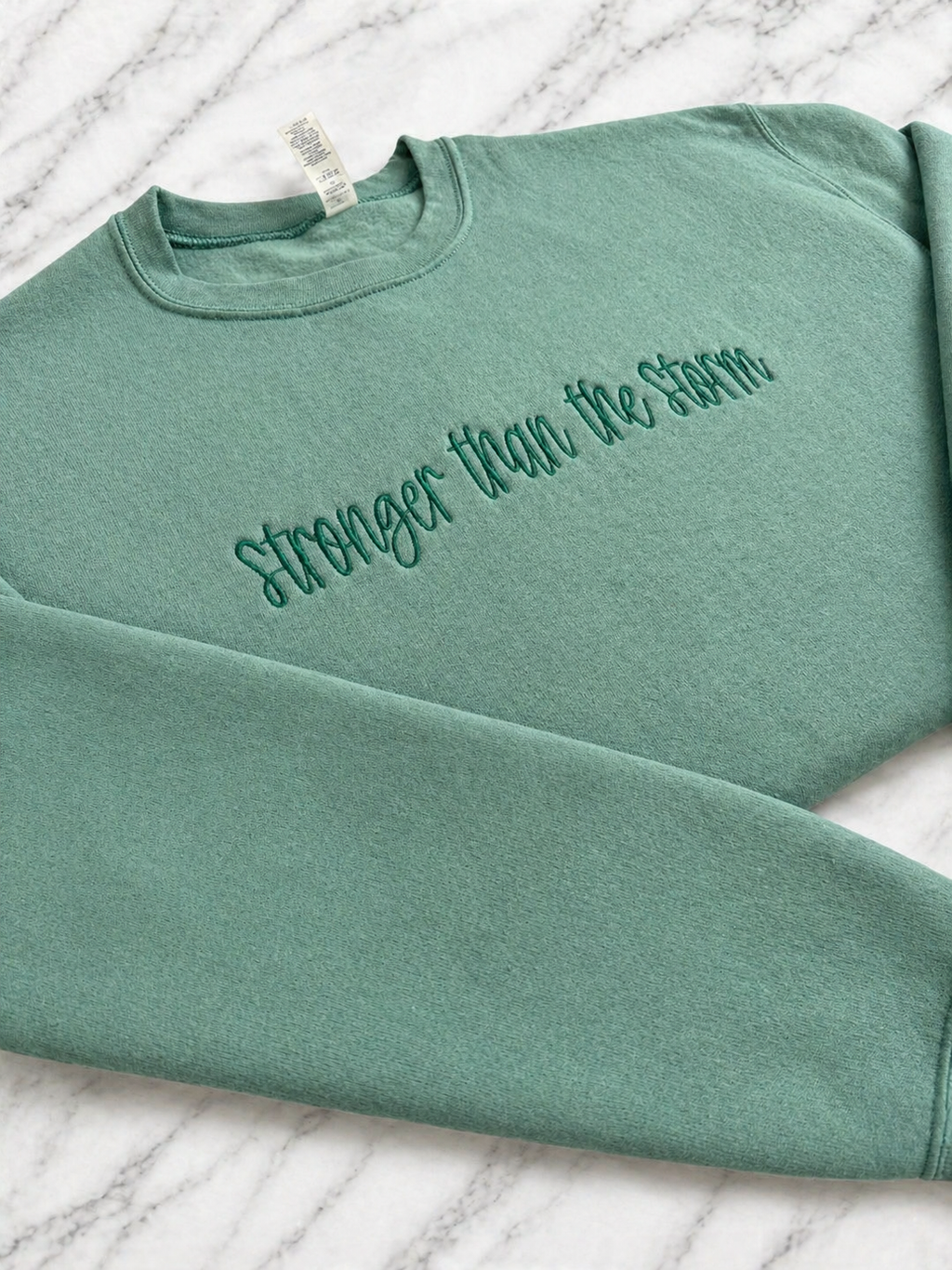 Stronger Than The Storm Crewneck
