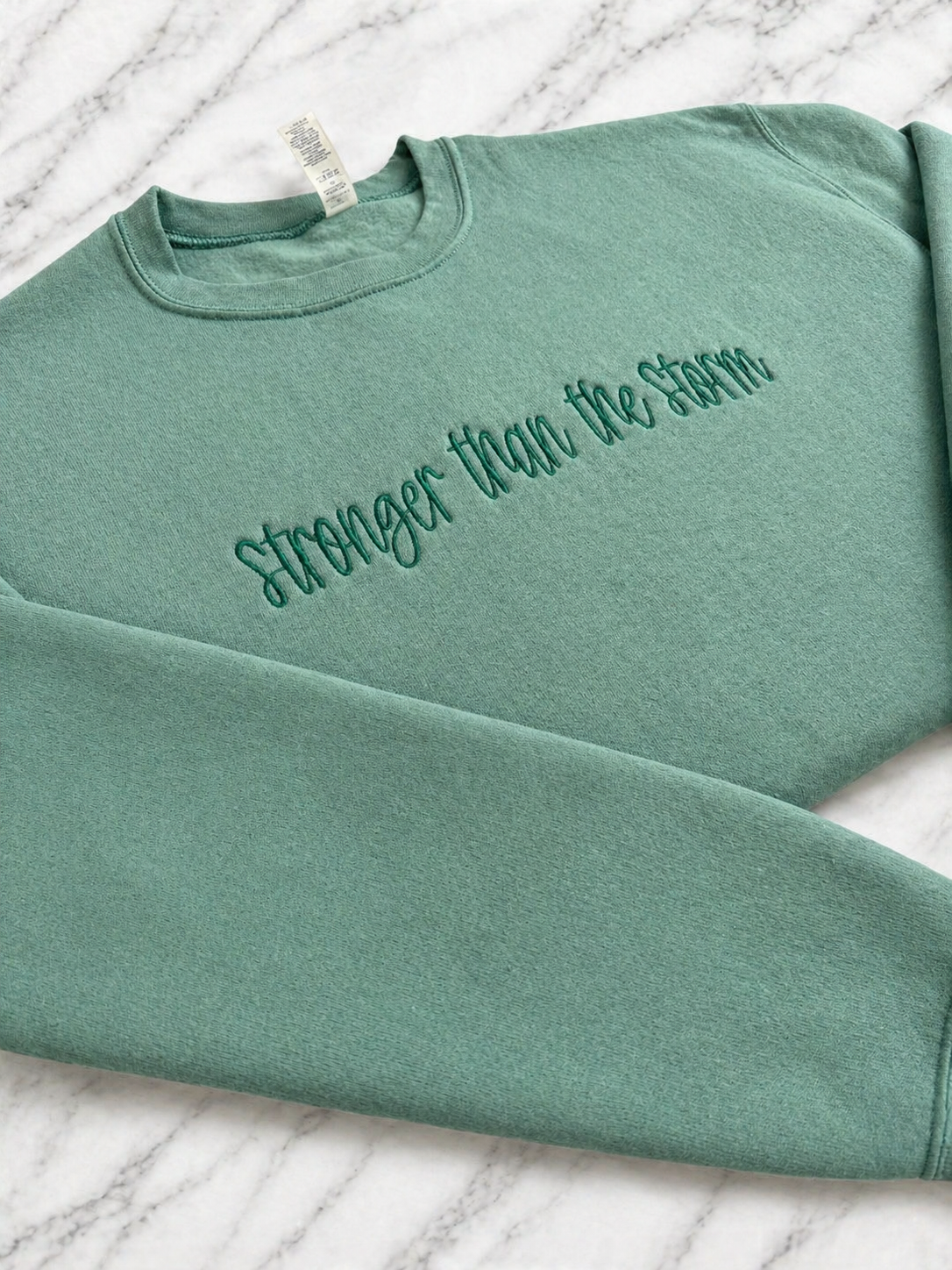 Stronger Than The Storm Crewneck
