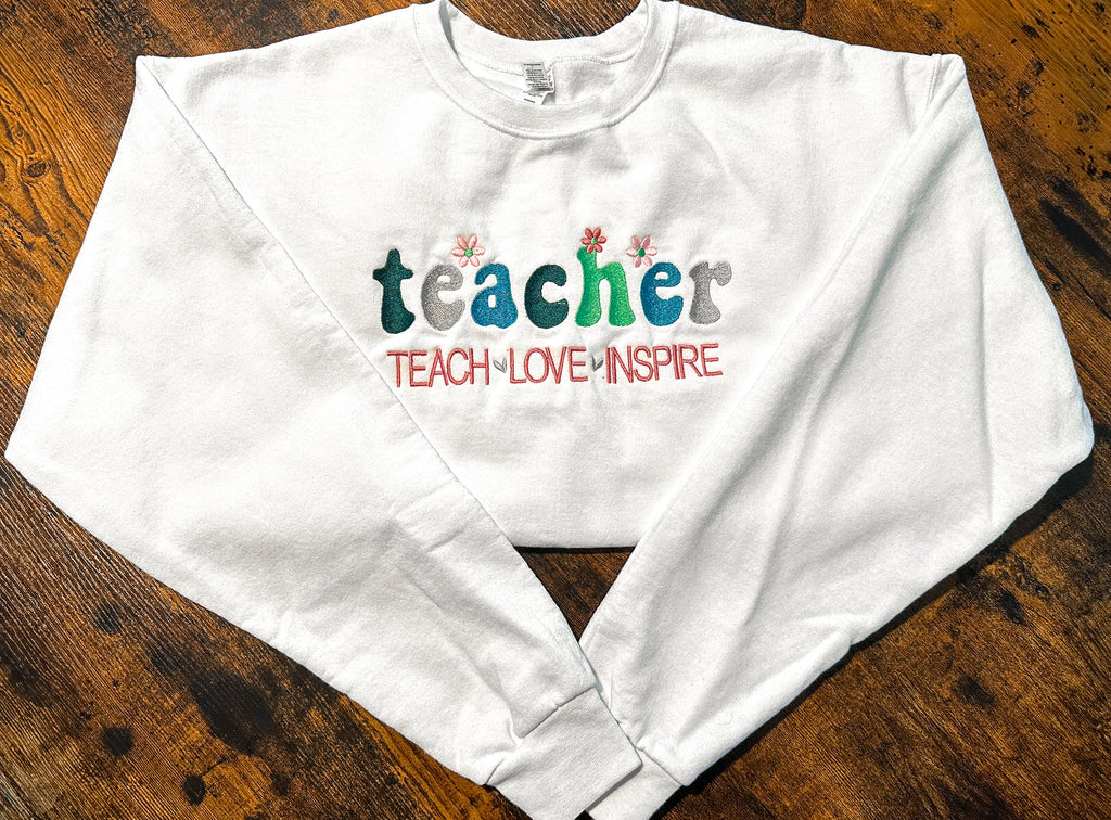 Teach Love Inspire Crewneck