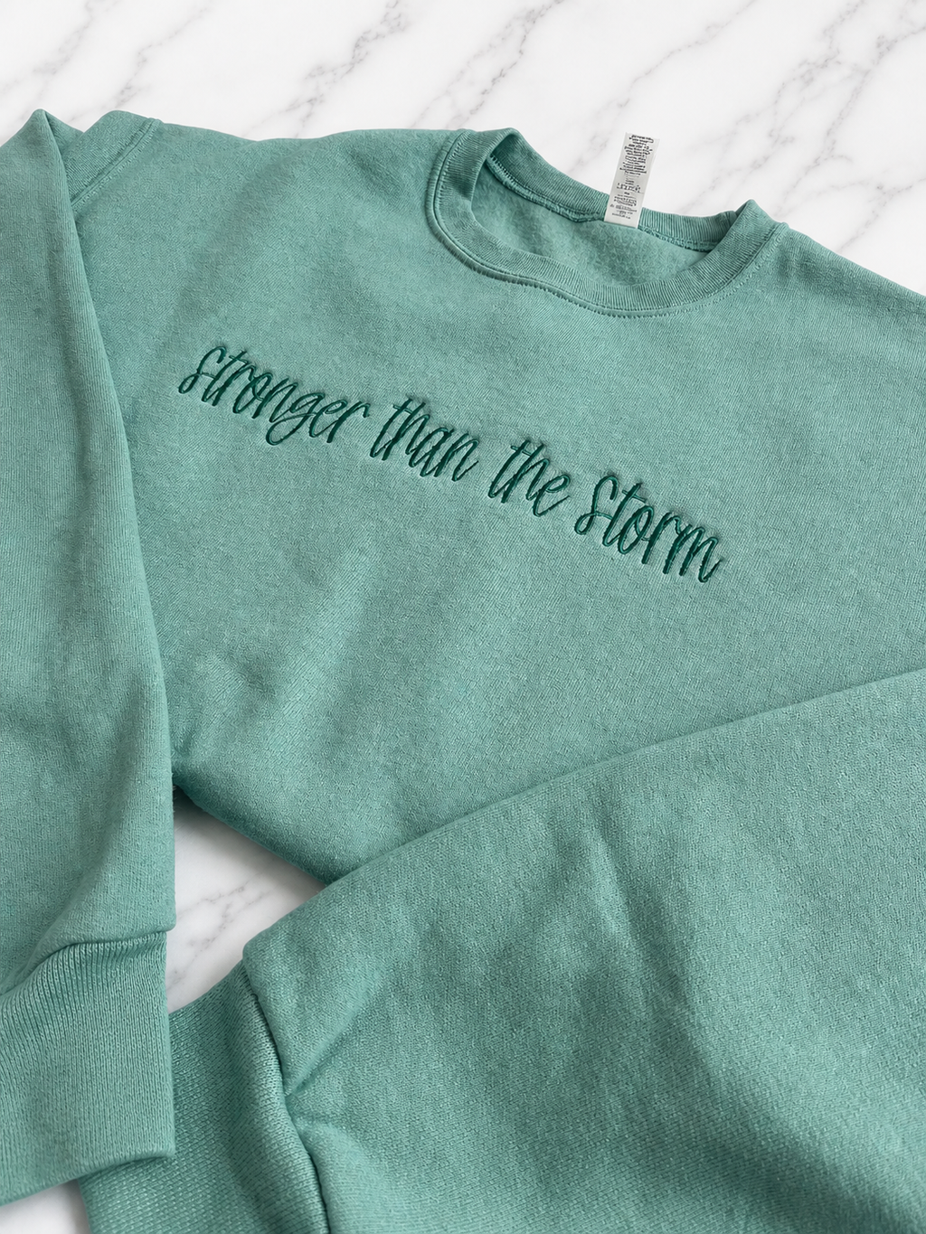 Stronger Than The Storm Crewneck