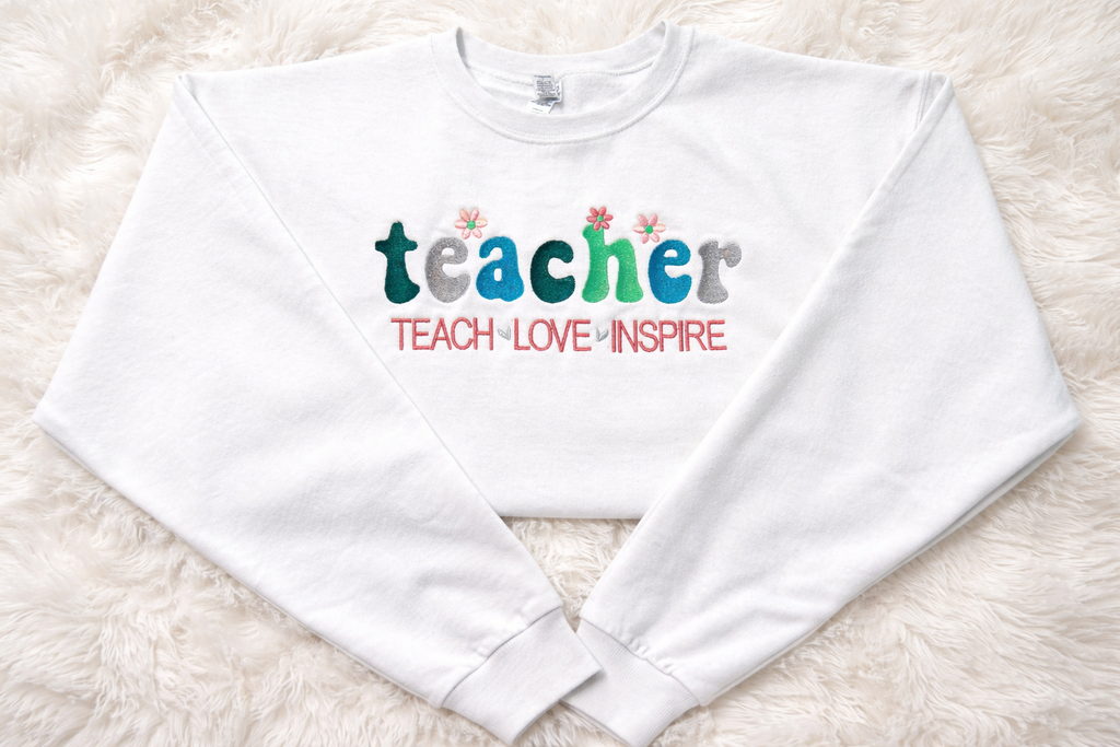 Teach Love Inspire Crewneck